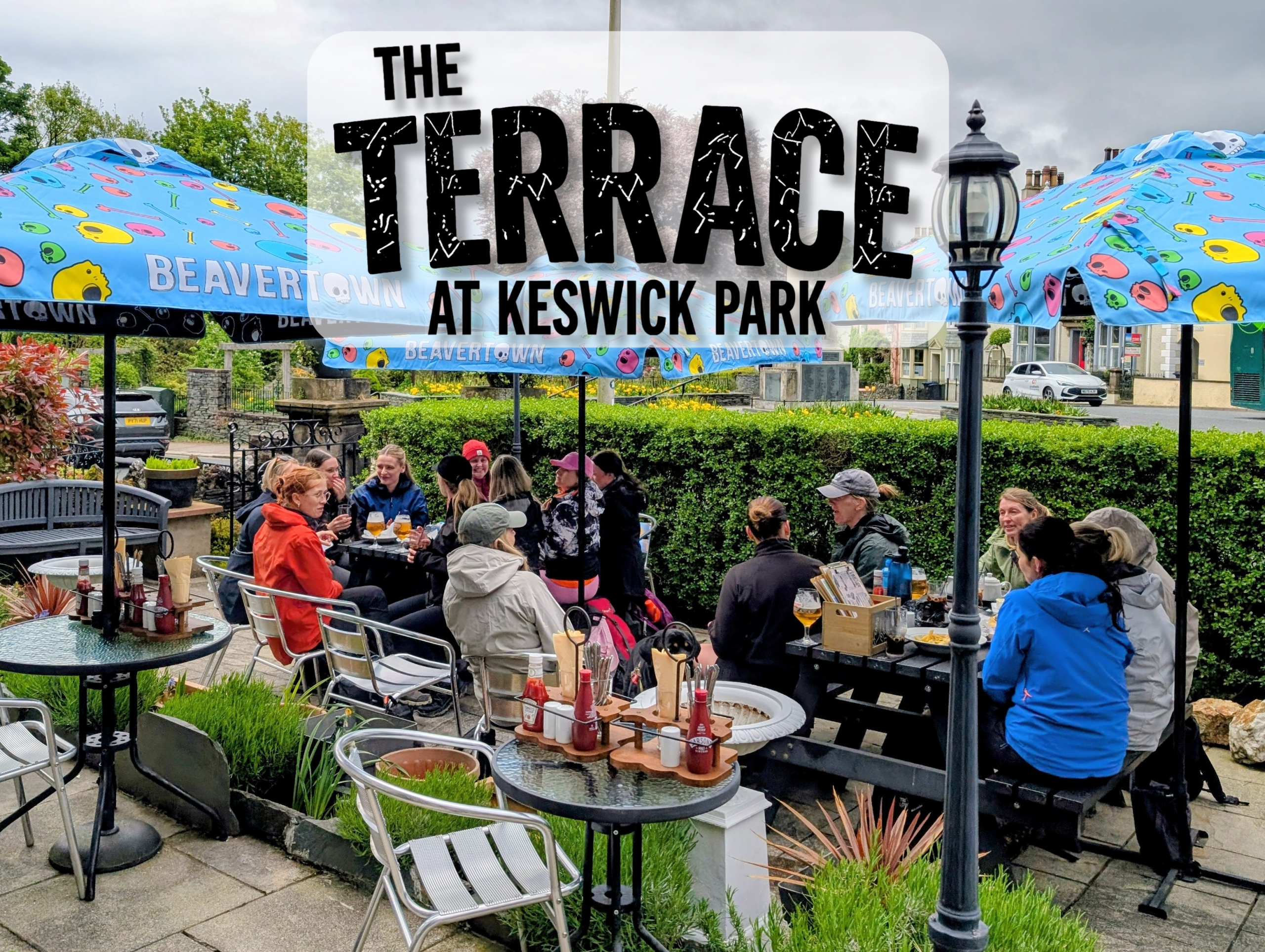 Guests dining outdoors at The Terrace at Keswick Park in Keswick